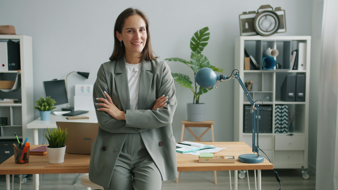 A chain’s operations director, arms folded, in her office