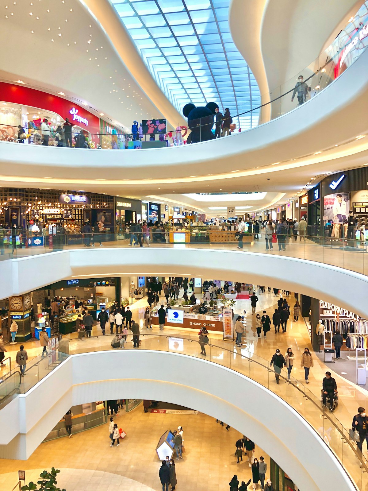 A busy shopping-centre mall over several floors
